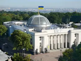 Aerial view of Ukraine’s Verkhovna Rada building in Kyiv, topped by the Ukrainian flag.