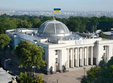 Aerial view of Ukraine’s Verkhovna Rada building in Kyiv, topped by the Ukrainian flag.