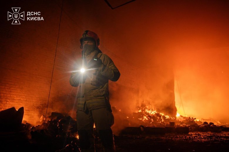 A rescuer at the scene of a fire in Kyiv.