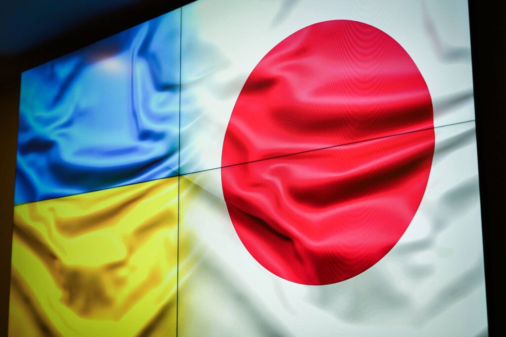 The flags of Japan and Ukraine displayed on a screen during a meeting between Ukraine's Minister for Restoration, Infrastructure and Transport Mykola Kalashnyk, Japan's Ambassador to Ukraine Yo Osumi, and JICA Ukraine Office Chief Osamu Hattori, October 2026. Photo: Mykola Kalashnyk/Telegram