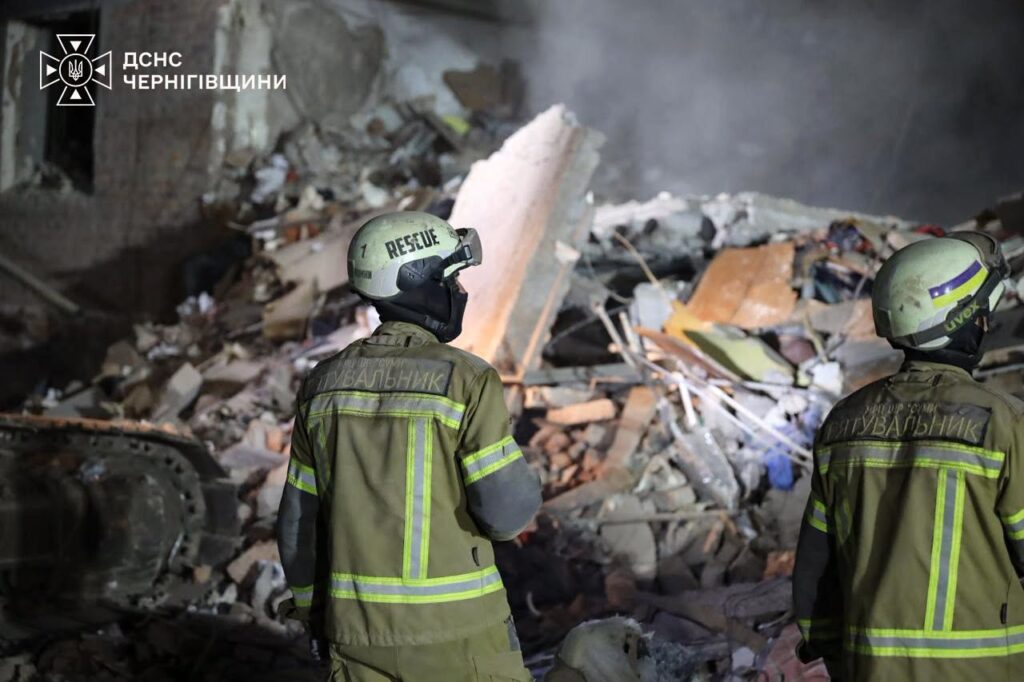 Rescuers at the rubble of the apartment building in Pryluky, Chernihiv Oblast